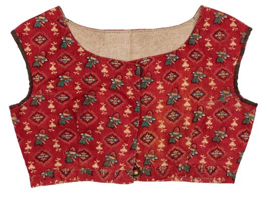 Red patterned blouse on a white background