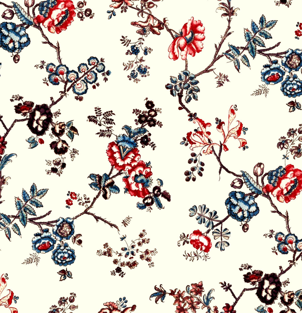 A repeating floral pattern on a warm cream background, featuring embroidered-style blossoms and leaves in red, blue, brown, and black.