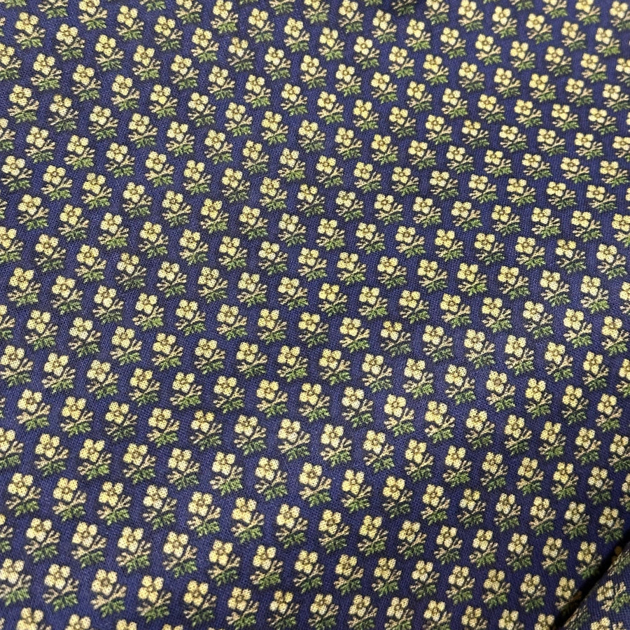 A close-up image of a fabric with a floral pattern.