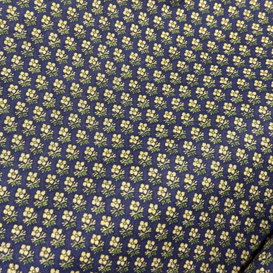 A close-up image of a fabric with a floral pattern.
